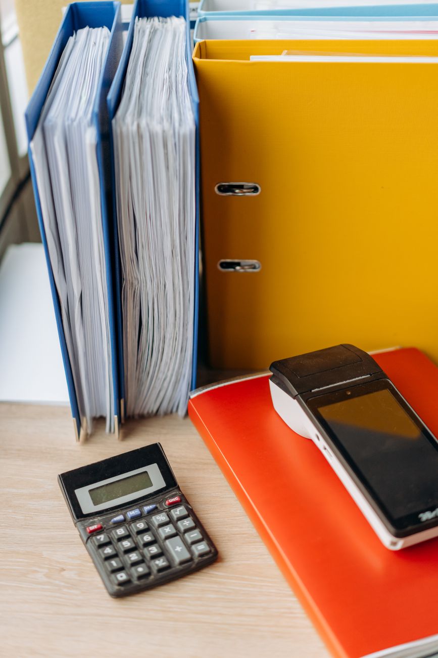 Calculations with financial receipt slips in binders